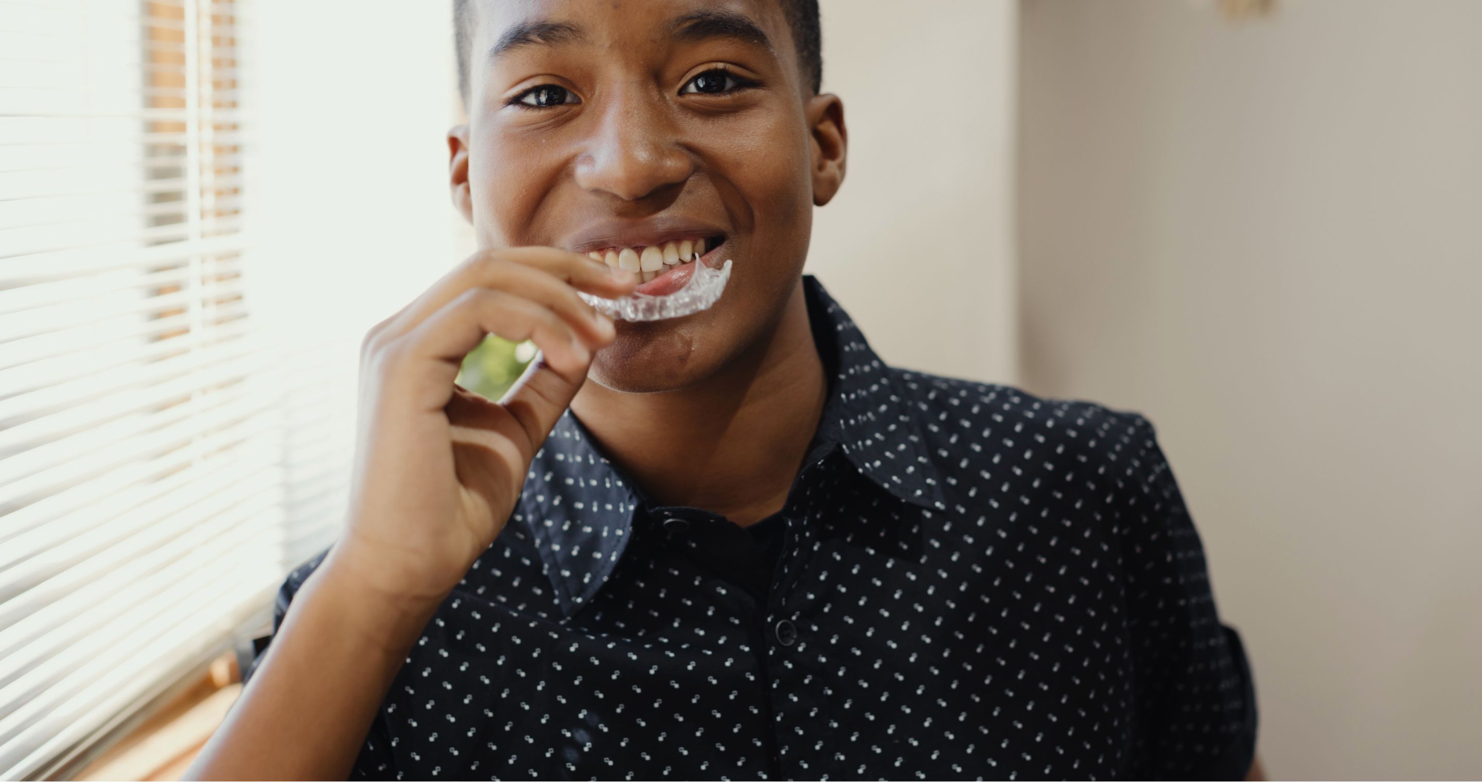 male patient smiling for a headshot