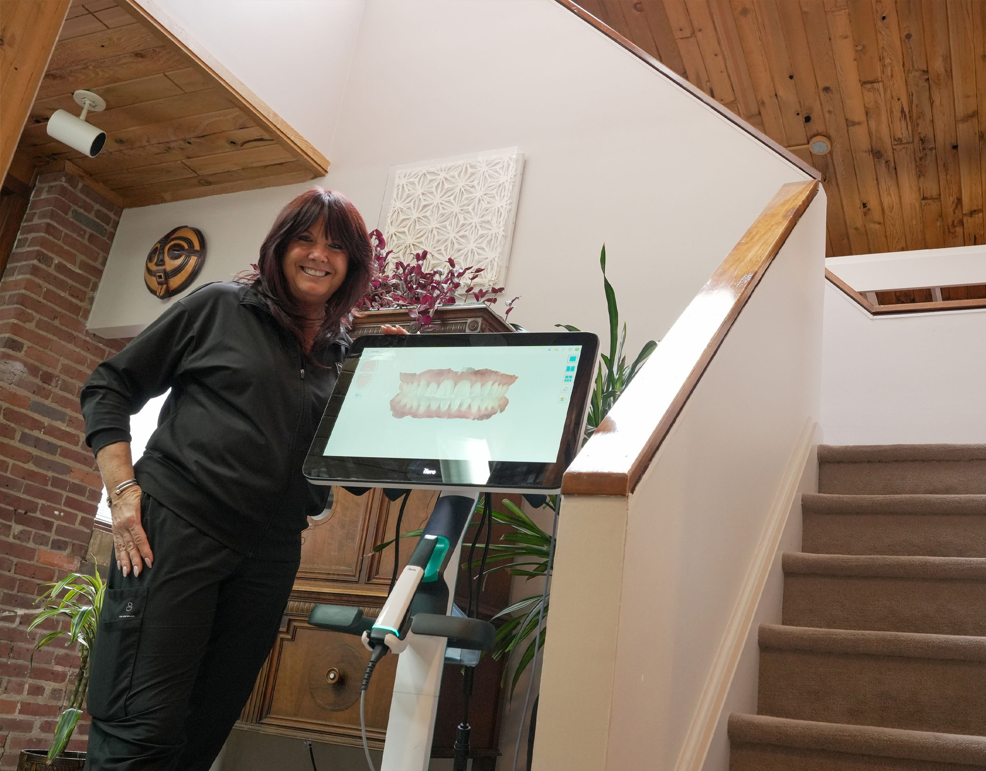 Team member standing by the stairs
